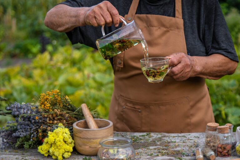 an-elderly-woman-brews-herbal-tea-selective-focus-TMYT2XD.jpg